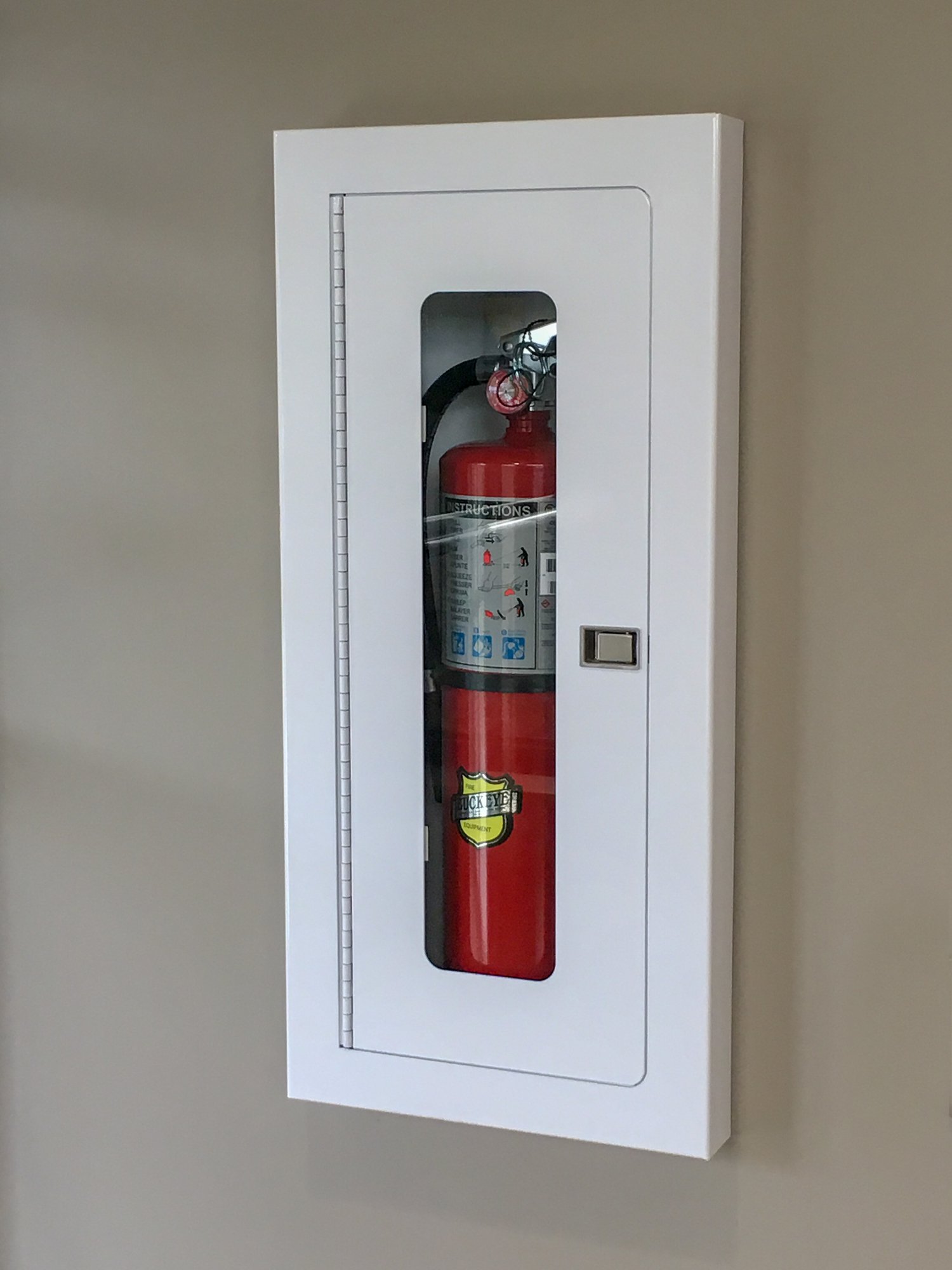 Where should fire extinguishers be located in an office